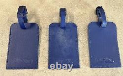 Ensemble de 3 étiquettes de bagages en cuir RIMOWA bleu.